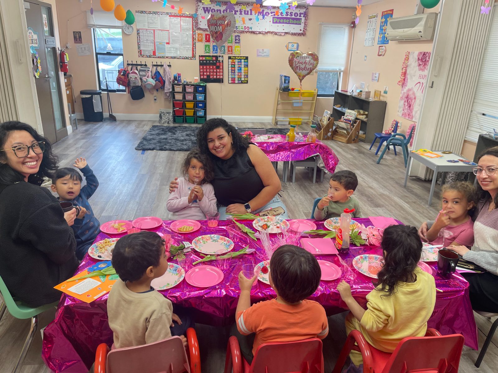 Families and children sharing a celebration breakfast at Wonderful Montessori Preschool